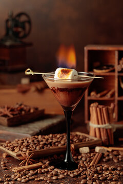 Cocktail of cream and coffee, decorated with a burning marshmallow.