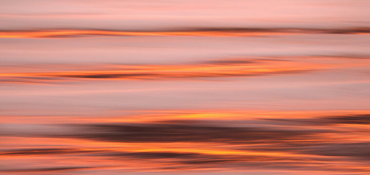 Abstract Sunset Reflections with Soft Horizontal Motion Blur