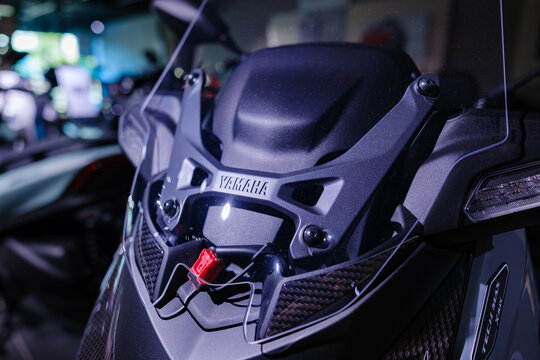 Moulded Yamaha lettering and Tech Max badge on an XMAX scooter