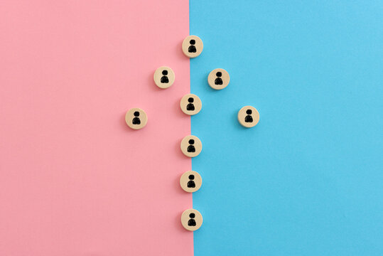 Wooden cubes with people icons over blue background, human resources and management concept