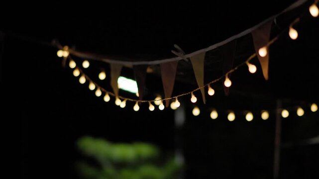 Turning On String Lights at a Backyard Campsite