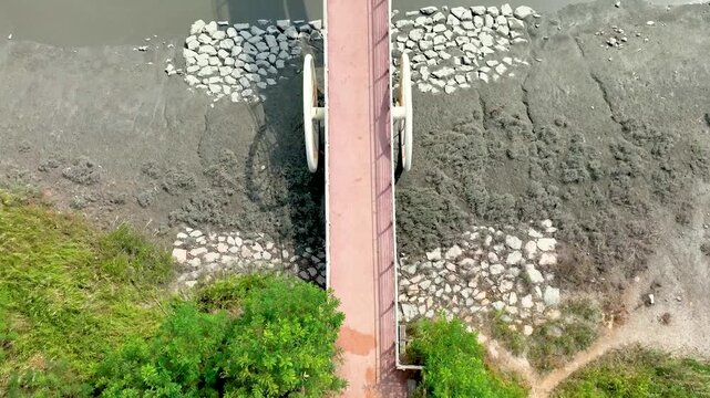 4K slow motion aerial drone shot of Misaeng Bridge over scenic tidal flats in Siheung, South Korea.