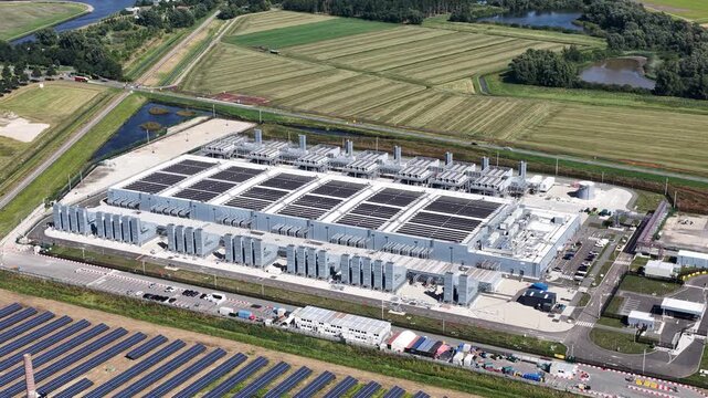 Aerial view modern data center and solar energy farm