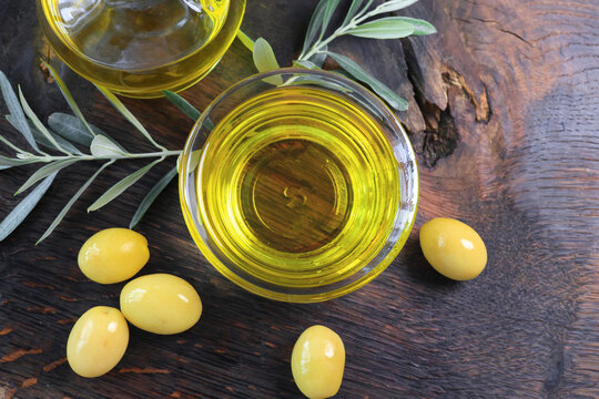 organic olive oil and olives in a glass bowl