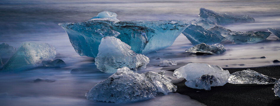 Small blue icebergs on the famous Diamond Beach, Jokulsarlon, Iceland
