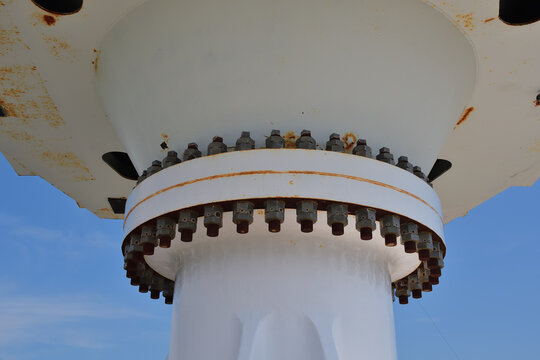 Large diameter bolted flange on vertical axis shaft.
