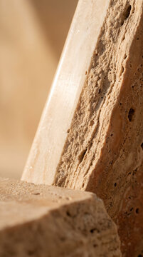 Layered travertine marble slabs with textured edges, representing natural materiality and texture