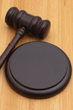 Judge gavel and block on wood desk for legal authority