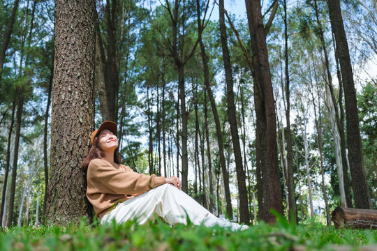 Portrait image of a woman sitting and relaxing in the park