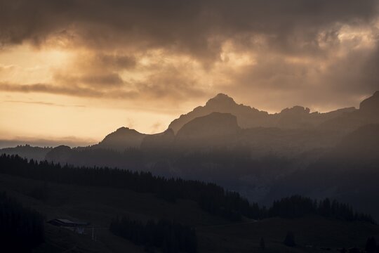 Mountain silhouettes with clouds at dusk, Jungfrau region, Bernese Oberland, Switzerland
