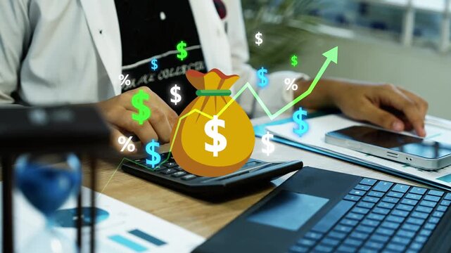 Businessman using a smartphone and calculator beside a laptop, with a holographic money bag and financial symbols overlay animation for online banking, Businessman Managing Digital Finance and Budget
