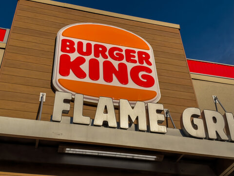 Calgary, Alberta, Canada. September 27, 2026. Low angle shot of the Burger King restaurant sign against a clear blue sky background.