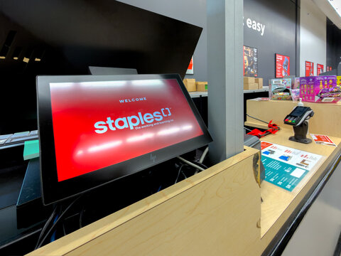 Calgary, Alberta, Canada. September 27, 2026. A digital checkout screen displaying the Staples logo at a retail store checkout counter.