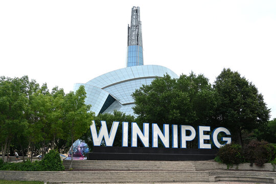Winnipeg, Manitoba, Canada - July 2, 2026: Winnipeg Sign and  Canadian Museum for Human Rights in the background, Winnipeg, Manitoba.