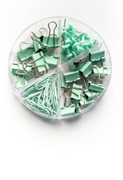 Mint green office supplies in clear organizer