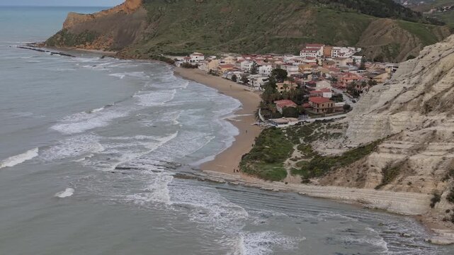 Lido Rossello beach and white cliffs in Sicily on a cloudy morning