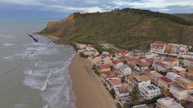 Lido Rossello beach and green cliff in Sicily on a spring morning