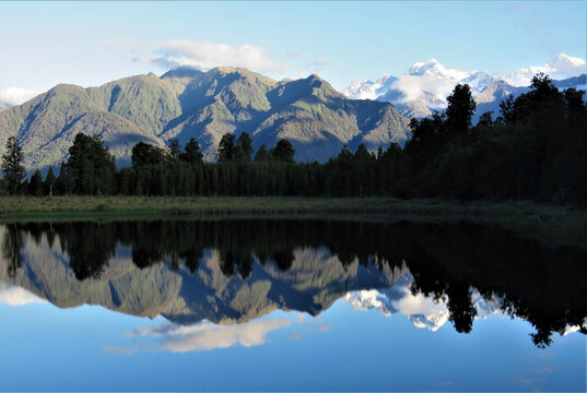 Lake Matheson - the Iconic Mirror Lake in New Zealand with Mirror Reflection of Mount Cook and Mount Tasman