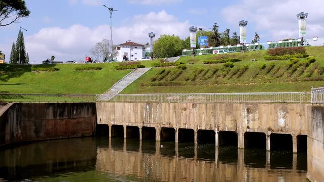 Water Spillway and Lush Green Terrace at Xuan Huong Lake Dalat Vietnam
