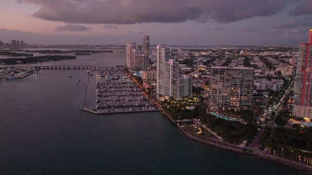 Miami marina with luxury yacht. Summer sunset vacation. Luxury South beach marina. Luxury yacht. Miami south beach view. Yacht club. Marina in Miami, Florida on sunset. Coastal marina skyline