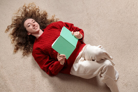 smile face candid people young adult woman portrait with notebook floor background copy space