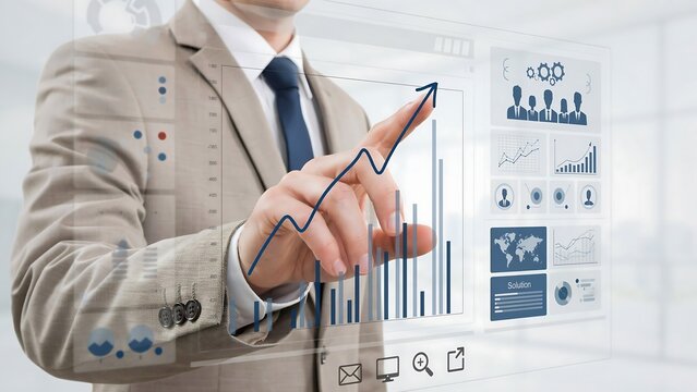 Businessman using a futuristic digital interface to analyze business growth charts and financial data
