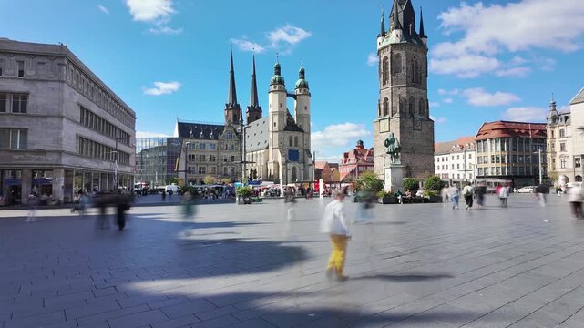 Market square in Halle (Saale) downtown on a sunny late summer day, wide angle time-lapse with motion blur of people, Saxony-Anhalt, Germany, 2026
