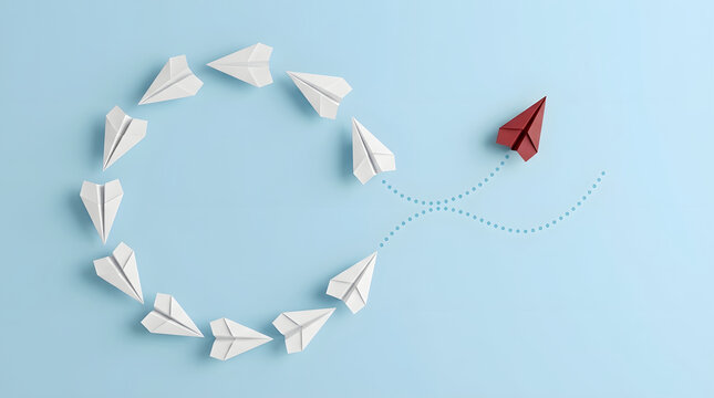 Conceptual Image of a Single Red Paper Airplane Breaking Away from a Circle of White Airplanes on a Light Blue Background, Symbolizing Leadership, Innovation, and Thinking Differently
