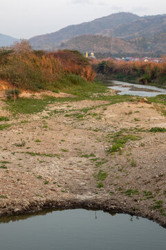 Low Water Level in Riverbed Landscape