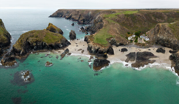 Aerial panorama landscape of Kynance Cove in Cornwall, UK with beach and calm ocean