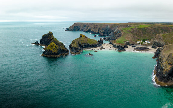 Aerial panorama landscape of Kynance Cove in Cornwall, UK with beach and calm ocean