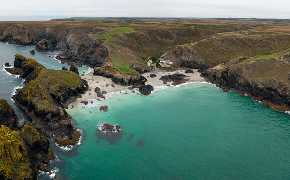 Aerial panorama landscape of Kynance Cove in Cornwall, UK with beach and calm ocean