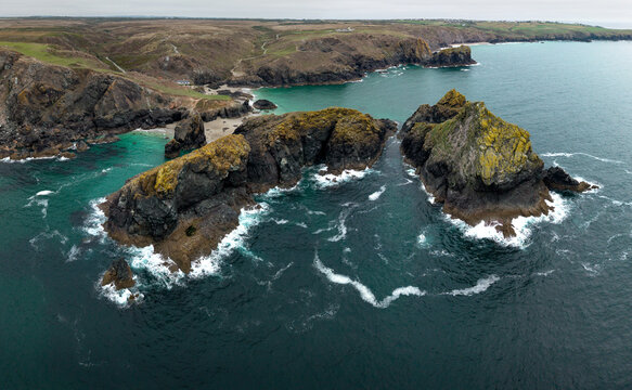 Aerial panorama landscape of Kynance Cove in Cornwall, UK with beach and calm ocean