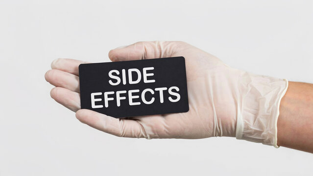 Hand in medical glove holding side effects sign photo illustration   