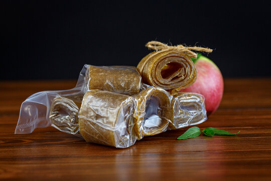 Natural dried apple pastila in vacuum bag on dark background