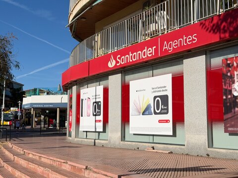 Mallorca, spain, septiembre 18, 2026 santander agentes bank office building on avinguda son maties, calvia, balearic islands, spain, with promotional posters