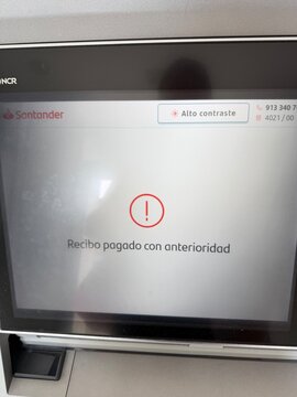 Mallorca, spain, septiembre 18, 2026 santander atm displaying recibo pagado con anterioridad error message, indicating a bill already paid