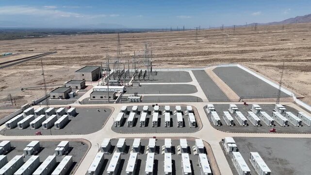 rows of energy storage batteries in desert landscape