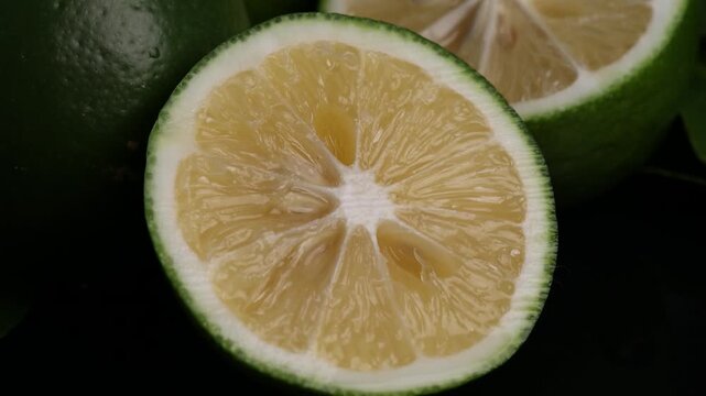 lime and lemon on a dark background