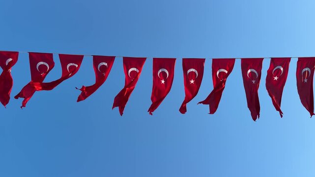 Turkish Flag waving in blue sky. Istanbul, Turkey.