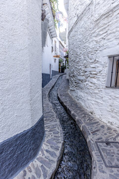 A picturesque alleyway in the historic centre of Pampaneira, Granada, Andalusia, Spain