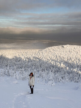 Woman Above Snowy Valley