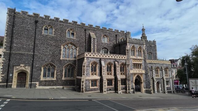 Historic Stone Building with Gothic Architecture and Ornate Windows