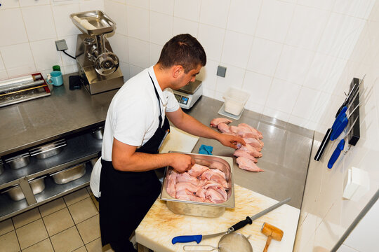 Restaurant Worker preparing chicken