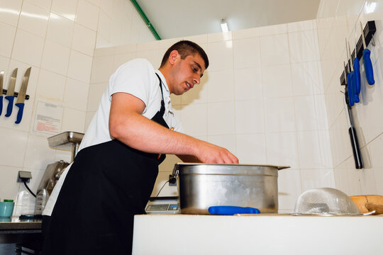Restaurant Worker Preparing Raw Meat