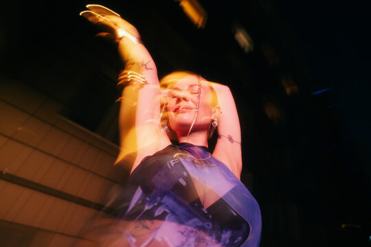 Woman Dancing at Night
