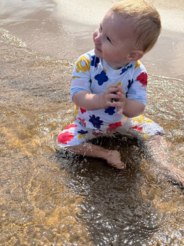 Child playing in the water at the beach