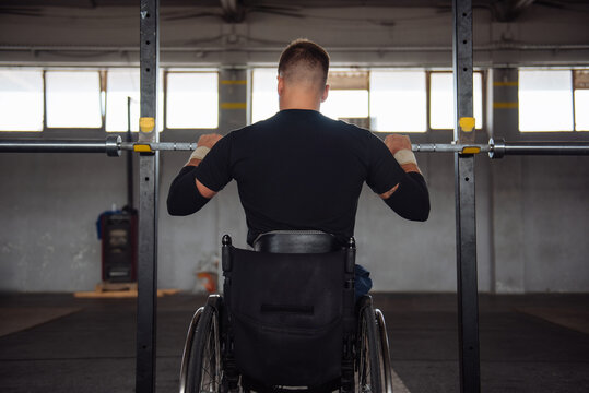Wheelchair Athlete Weightlifting In Gym For Adaptive Fitness
