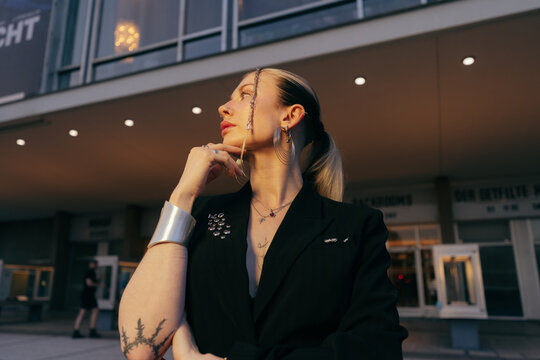 Elegant Woman Outside Cinema Golden Hour