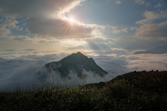 Sunrise Over Mountain Peak Above a Sea of Clouds